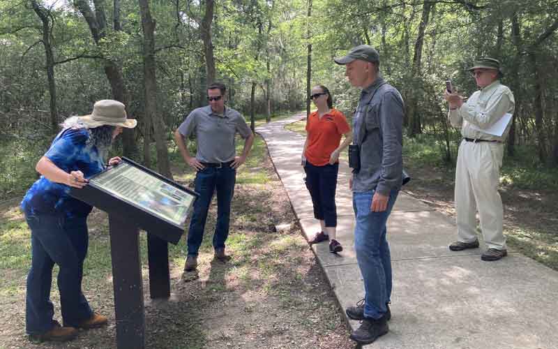 Photo of people on a trail