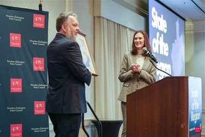 Executive Director Chuck Wemple standing next to outgoing Board Chair Sallie Alcorn at last year's 2025 Annual Meeting