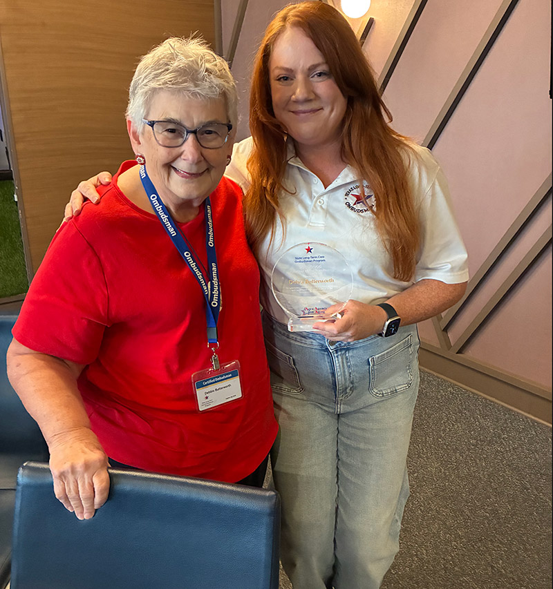 Recipient Debbie Butterworth being presented the Bob Wood Volunteer of the Year Award