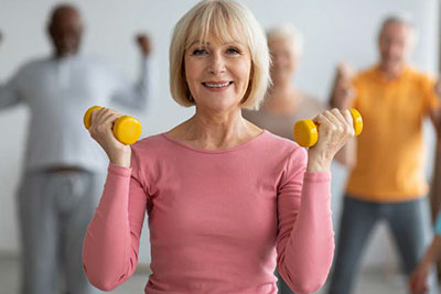 Seniors exercising with dumbbells