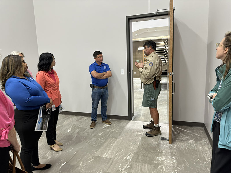 People looking at an open doorway